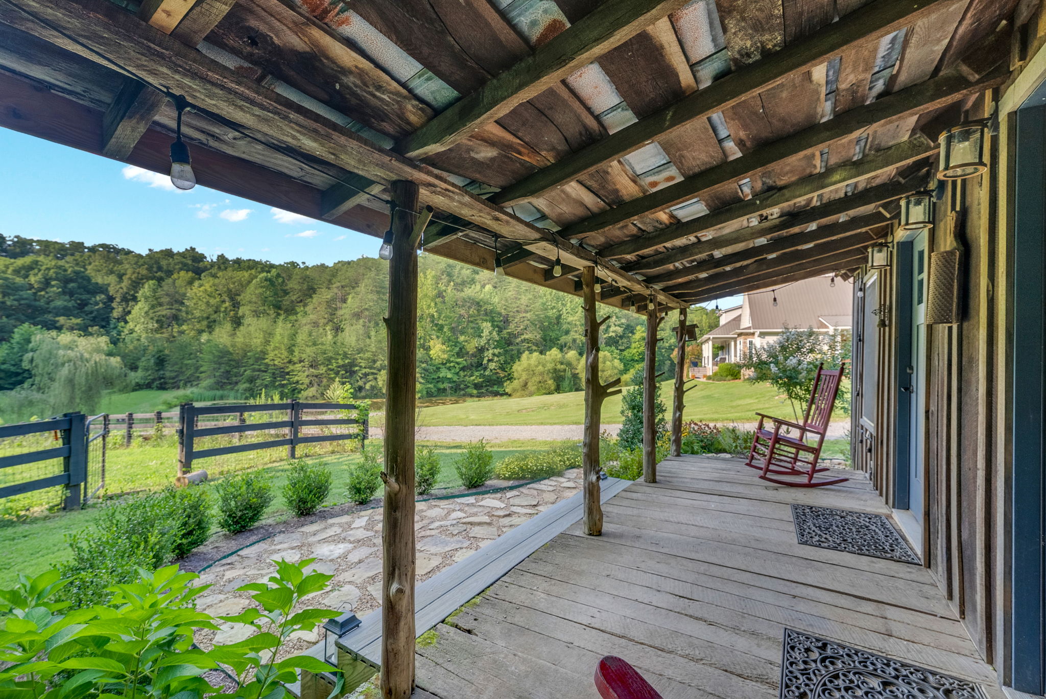 View from the guest cabin porch across the pond and private grounds toward the main residence